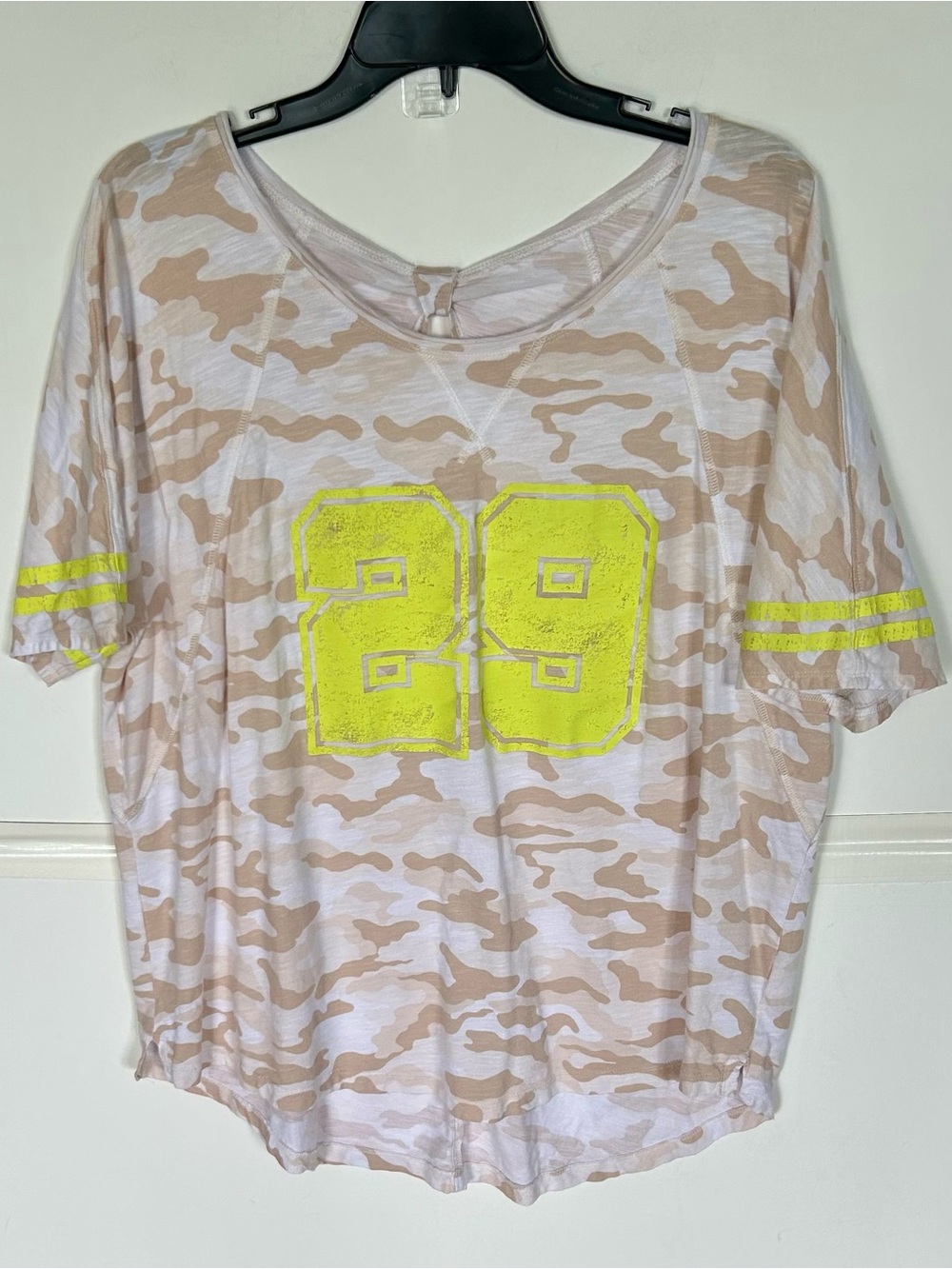 Maurices woman’s SS tan & cream camo tee with neon yellow 29 on front